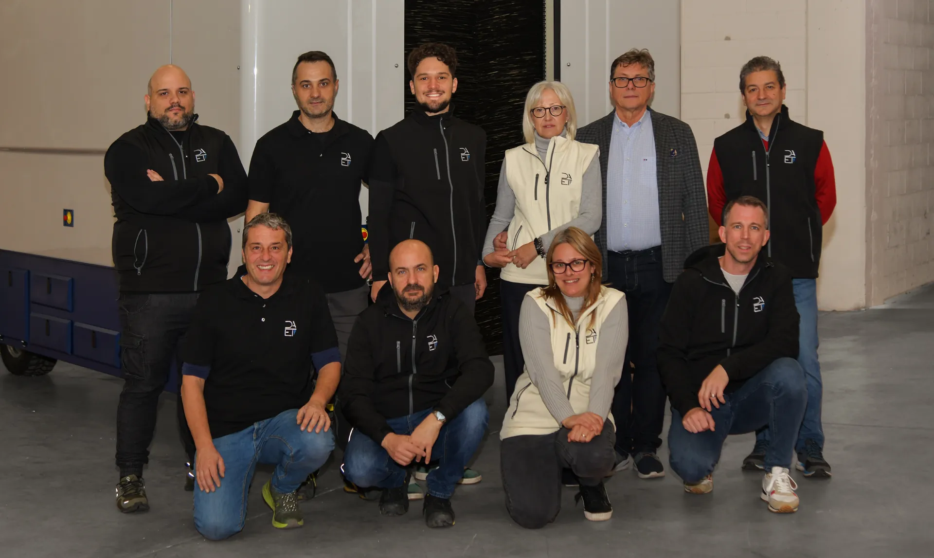 The DAET team in the workshop with A.P.M.-01, the autonomous winter vine pruning machine